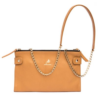 A tan purse with gold chain straps and a black handle.