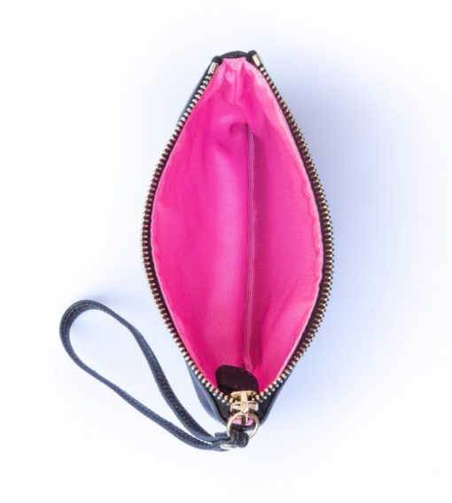 A pink purse is shown with the handle extended.