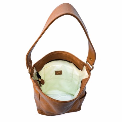 A brown leather bag with a white interior.
