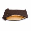 A brown bag with a yellow lining on top of it.