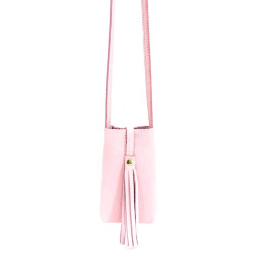 A pink purse with a long strap hanging from the side.