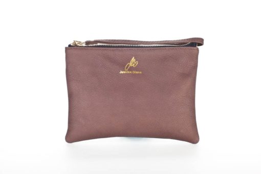 A brown leather purse with gold lettering on it.