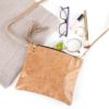 A purse with some glasses and makeup on it
