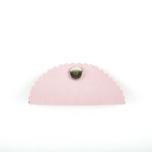 A pink purse with a silver clasp on top of it.